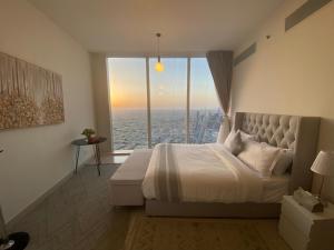 En eller flere senge i et værelse på شقة برج رافال Rafal Tower