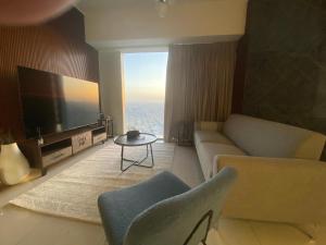 Et tv og/eller underholdning på شقة برج رافال Rafal Tower