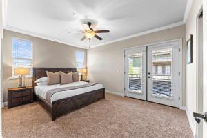 a bedroom with a bed and a ceiling fan at NEW Chic 2BR Stay with Heated Pool Gym & Mini Golf in Steamboat