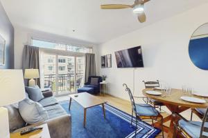 a living room with a couch and a table at Sapphire of Belltown Court in Seattle