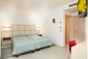 Voodi või voodid majutusasutuse Hotel Miorelli toas