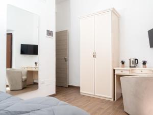 A television and/or entertainment centre at B&B La Via dei Mulini