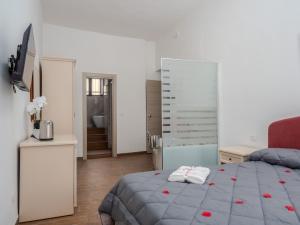A bed or beds in a room at B&B La Via dei Mulini