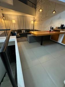 a living room with a table and a couch at casita briones in Xalapa +1 photo