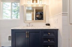 a bathroom with a sink and a mirror at Hidden Lake House With Hot Tub & Views! in Corralitos +78 photos