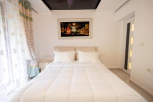 Postel nebo postele na pokoji v ubytování Apartment KLER-Elegant Stay Ali Demi
