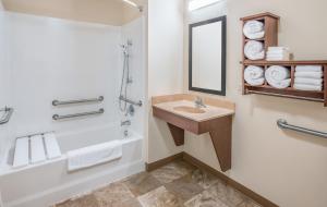 a bathroom with a sink and a shower at My Place Hotel - Sioux Falls, SD in Sioux Falls +16 photos