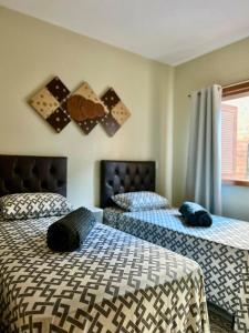 Ένα ή περισσότερα κρεβάτια σε δωμάτιο στο Apartamento no centro de Gramado