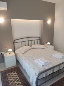 Postel nebo postele na pokoji v ubytování Katerina summerhouse