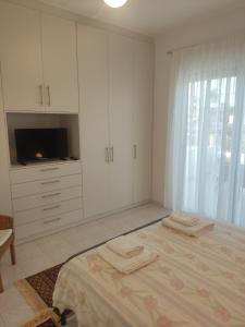 Postel nebo postele na pokoji v ubytování Katerina summerhouse