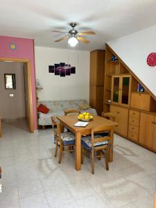 a kitchen and dining room with a table and chairs at Casa Vacanze Giulia in Maratea