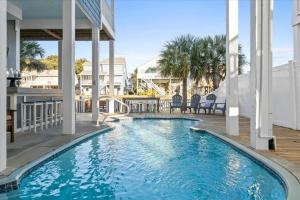 a swimming pool in the middle of a building at FREE CABANA - Dock Holiday by Pier 42 in Holden Beach
