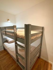 a bedroom with two bunk beds in a room at Joli Perot in La Rochelle +13 photos