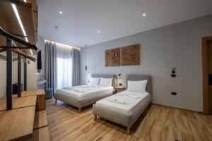 Postel nebo postele na pokoji v ubytování Hotel Kroi