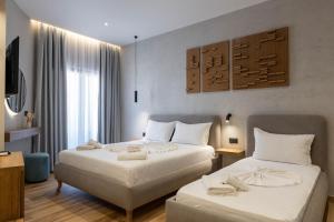 Postel nebo postele na pokoji v ubytování Hotel Kroi