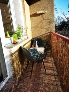 a chair and a table on a balcony at Star #5B515 in Brno