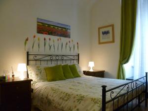Giường trong phòng chung tại Holiday Home Il Sogno A San Pietro