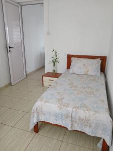 Postel nebo postele na pokoji v ubytování Gris Gris Guest House
