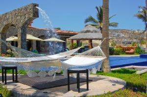 a resort with a hammock and a swimming pool at Villa Estero by Cabo Villas in San José del Cabo +16 photos
