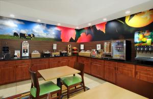 a fast food restaurant with a table and chairs at Fairfield Inn & Suites Colorado Springs South in Colorado Springs