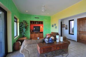 a living room with a couch and a table at Villa Langosta by Cabo Villas in La Paz