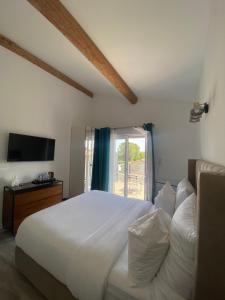 Postel nebo postele na pokoji v ubytování O Bain Soleil + 37 fotografií