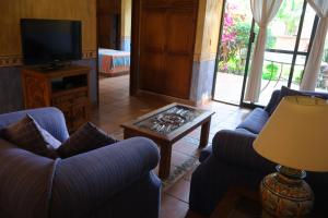 a living room with two couches and a coffee table at Villas Don Zeferino in Chiconcuac