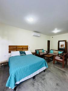 Postel nebo postele na pokoji v ubytování Gecko Hotel