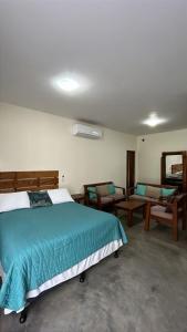 Postel nebo postele na pokoji v ubytování Gecko Hotel
