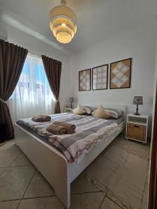 a bedroom with a large bed and a large window at Apartment Melani in Vir