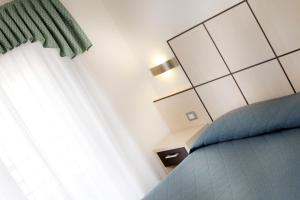 Voodi või voodid majutusasutuse Hotel Miorelli toas