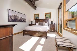 a bedroom with a bed and a dresser and a window at Apex Manor in Winter Park +57 photos