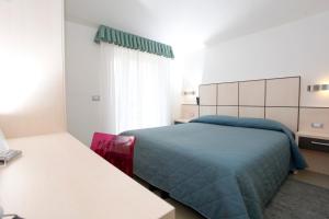 Voodi või voodid majutusasutuse Hotel Miorelli toas