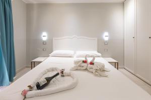 Postel nebo postele na pokoji v ubytování Domu Ajaju Guest House