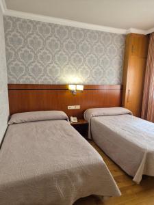 Posteľ alebo postele v izbe v ubytovaní Hotel HHB Pontevedra Confort