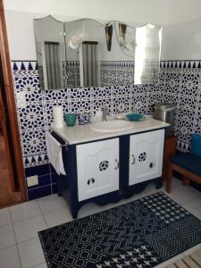 a bathroom with a sink and a mirror at Maison Haute in Moux-en-Morvan