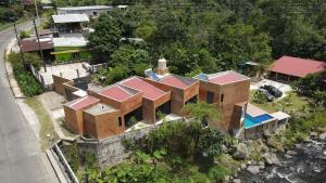 an aerial view of a house with a swimming pool at Casa La Kin in Cacahuatán
