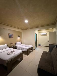 Ένα ή περισσότερα κρεβάτια σε δωμάτιο στο Dahab Holiday Hotel