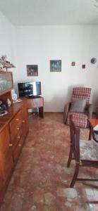 a living room with a couch and a tv at Casamare in Roseto degli Abruzzi