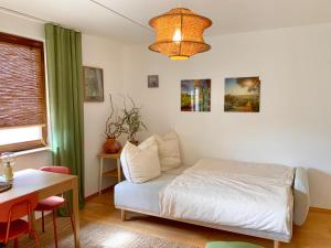 Postel nebo postele na pokoji v ubytování Ruhe & Charme - Familien Apartment 4 Betten
