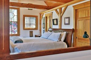 a bedroom with a bed in a room at Casita Alta - Woodstock, VT - Main House & Pool House with Private Heated Pool and Mountain Views in Woodstock +129 photos