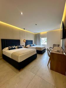 Postel nebo postele na pokoji v ubytování Hotel y Cabañas Covemar