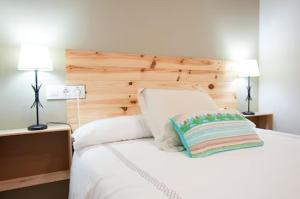 Triana 103 Rooms & Suites客房内的一张或多张床位