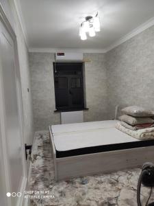 Postel nebo postele na pokoji v ubytování ЖК Guncha apartments