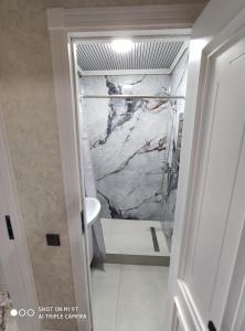 Koupelna v ubytování ЖК Guncha apartments