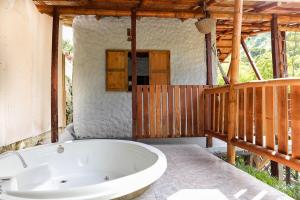 a bath tub in the middle of a room at Glamping Salvando Rios in Pereira