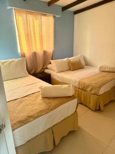 Hotel mantarraya 객실 침대