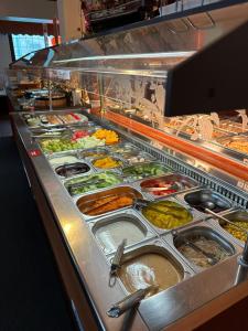 a buffet line with many different types of food at Hotel Restaurant Ming Court in Hürtgenwald