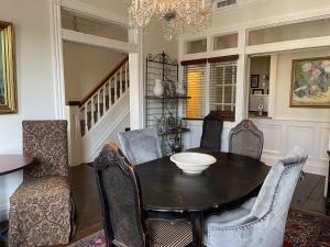 a dining room with a table and chairs at Dickson Street Inn in Fayetteville