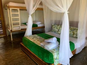 a bedroom with two bunk beds and a ladder at Cocobeach Palomino in Palomino +54 photos